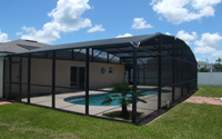 The screened in pool at the back of this great house!